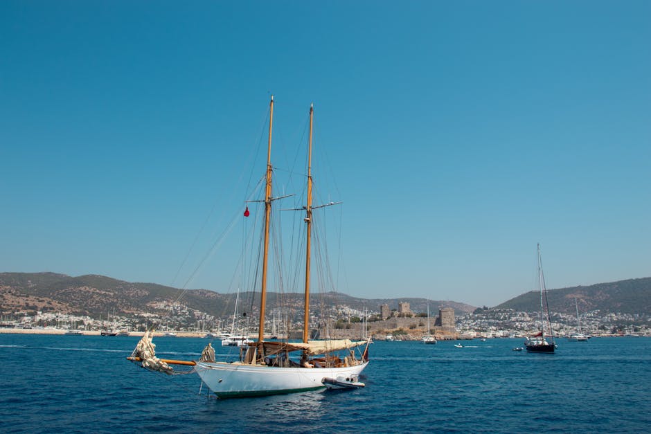 Stunning view of Bodrum Castle in Turkey with sailboats on a clear summer day.
